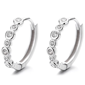 925 sterling silver huggie earrings with bezel-set round zircons on white background