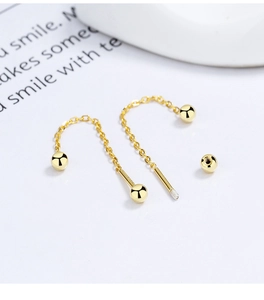 Close-up of S925 sterling silver ball drop earrings with 18K gold plating finish