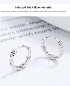 Macro shot of 925 sterling silver chain earrings with a polished industrial finish