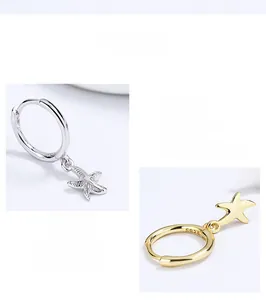 Macro detail of S925 sterling silver starfish hoop earrings with textured finish