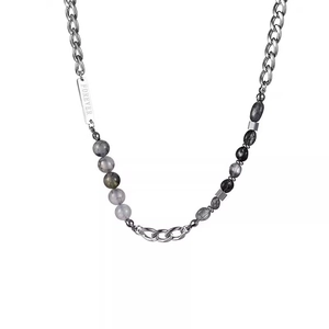 Close-up of titanium steel chain necklace with stone beads and Forever engraved plate