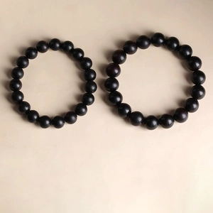 Minimalist men's vintage black wooden bead bracelets with smooth polished finish