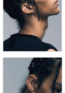 Macro detail of silver thorn hoop earring with textured finish on model