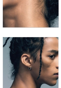 Detail view of silver textured hoop earring worn by male model for minimalist style