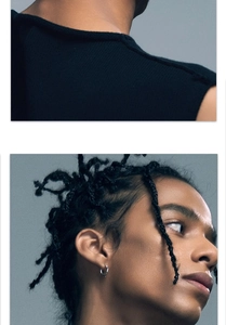 Close-up of minimalist silver hoop earrings worn by a model in a trendy urban fashion style