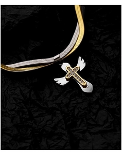 Detail of two-tone snake chain necklace with crystal-studded gold cross and silver wing charm