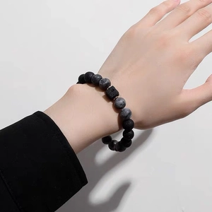 Handmade volcanic stone bead bracelet for men featuring matte black lava and grey stone beads