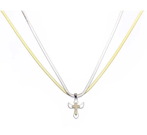 Detailed macro view of two-tone gold and silver snake chains with winged cross pendant