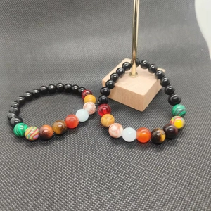 Detail view of solar system galaxy bracelets with 8mm obsidian and natural stone beads
