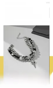 Detail of titanium steel star pendant with Cuban chain and crystal beads in hip hop style