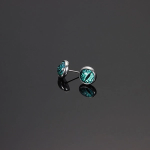 Cyberpunk evil eye stud earrings with green glass inlay and polished steel finish