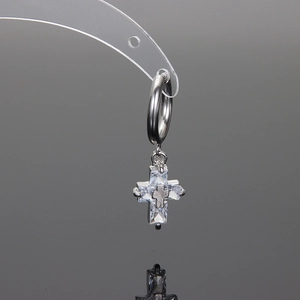 Silver titanium cross earrings with clear zircon stones on a deep grey background