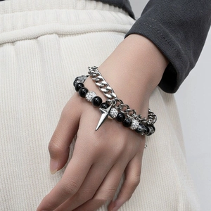 Star charm cuban chain bracelet set with ice-cracked beads on a model's wrist