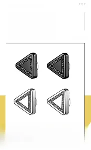 Detail of triangle clip-on earrings with textured pattern in black and silver finishes