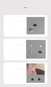 Detail of silver and black triangular clip-on earrings with polished metal finish