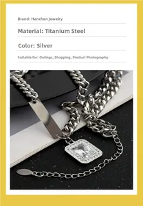 Detailed view of silver titanium steel Cuban chain with zircon and rectangular metal plate