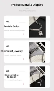 Detail of silver Cuban chain necklace with rectangular crystal pendant and polished finish
