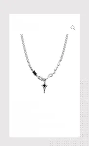 Detail of silver titanium necklace with star pendant and black zircon stones