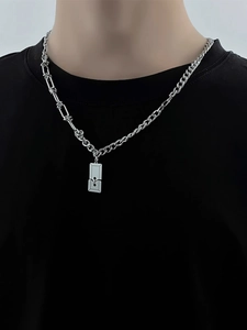 Close-up of titanium steel necklace with rectangular pendant and dual-style chain on model