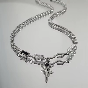 Silver star necklace with black cubic zirconia and pearls in asymmetric Cuban link chain