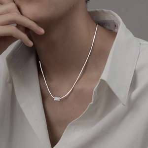 Minimalist silver snake chain necklace with engraved rectangular sliding metal pendant
