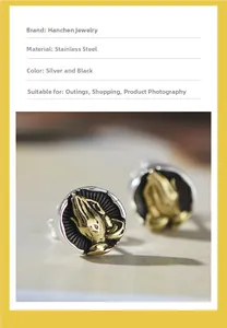 Detailed relief of praying hands on a vintage silver and black stainless steel stud earring