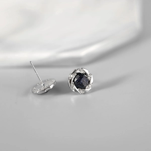 Minimalist silver stud earrings with blue starstone and sparkling zircon stone setting