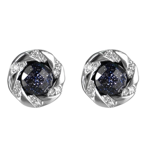 Star-shaped stud earrings with dark blue gemstone and silver woven border on white background