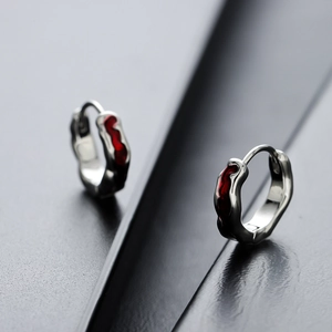 Irregular silver hoop earrings with red lava texture drip oil enamel accents