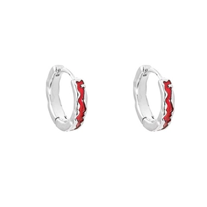 Minimalist silver hoop earrings with red wavy enamel pattern on a white background