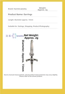 Detail view of silver cross earring with black zircon showing 15mm size and 2g weight