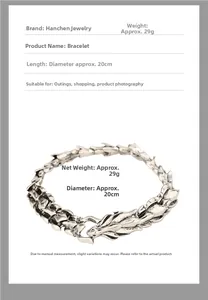 Macro shot of silver dragon scale chain bracelet with head clasp, 20cm length detail