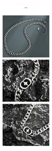 Dettaglio collana a catena cubana argento con pendente a stella e chiusura a moschettone