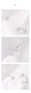 Vues détaillées de boucles d'oreilles étoile en argent sous trois angles sur soie