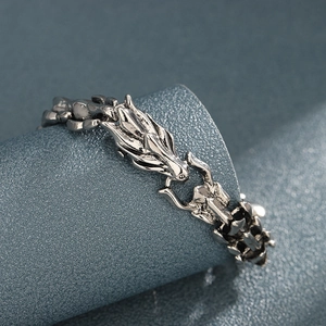 Retro dragon scale bracelet in silver finish with detailed dragon head relief design