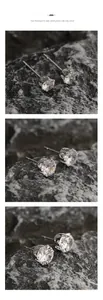 Detailed view of 6-prong silver stud earrings with clear round-cut cubic zirconia stones
