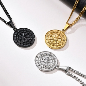 Compass nautical pendant necklaces in black, gold, and silver with layered metal chains