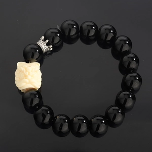 Obsidian bead bracelet with white guardian lion head and silver crown charm accent