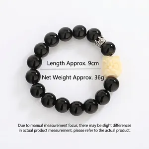 Minimalist obsidian beaded bracelet with lion pendant and silver crown charm, 36g weight