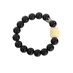 Obsidian beaded bracelet with carved lion mascot and silver crown detail on white background