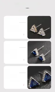 Detailed view of triangle cut earrings with blue sapphire zircon and hollow pattern