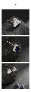 Macro view of triangular stud earrings with blue sapphire and white zircon stones