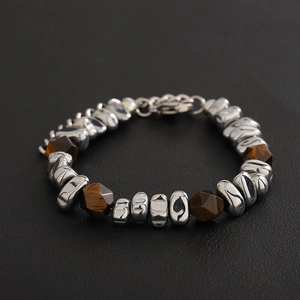Vintage bead bracelet with irregular silver metal and brown tiger eye stones on black leather