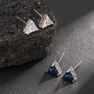 Triangle sapphire and zircon stud earrings with intricate vintage metal engraving