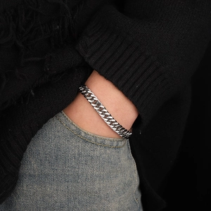 Classic silver titanium steel Cuban link bracelet for men with polished finish on wrist