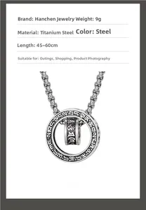 Macro detail of titanium steel mantra pendant showing fine engraving and box chain