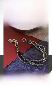 Close-up of double-layer titanium steel bracelet featuring black cracked pattern beads