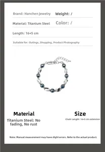 Titanium steel beaded bracelet with black beads and 5cm extension chain details