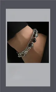 Close-up of double-layer stainless steel bracelet with crackle-patterned marble beads