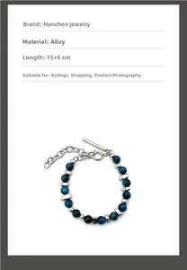 Macro detail of natural blue tiger eye beaded bracelet with silver toggle clasp